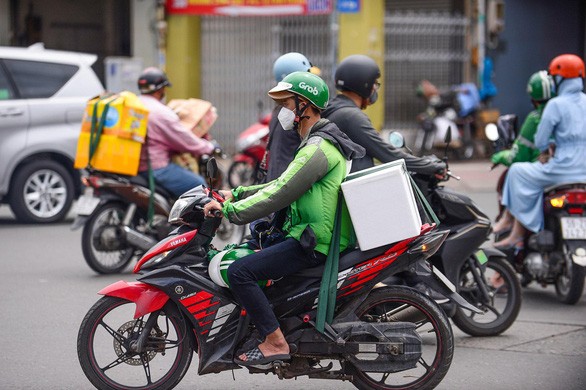 Bộ Công Thương yêu cầu Grab minh bạch thu phí sau khi dừng thu 'phụ phí nắng nóng'
